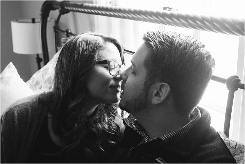 Flint couple Steven & Sarah share a kiss during their in-home session.