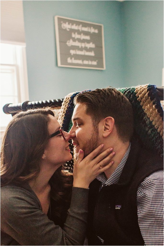 Flint couple Steven & Sarah share a kiss during their in-home session.