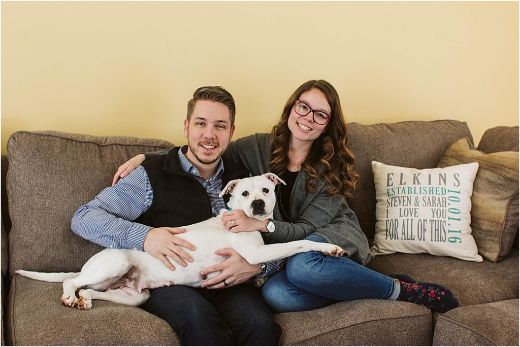 Flint couple Steven & Sarah snuggle up on the couch with their new rescue dog, Rosie.