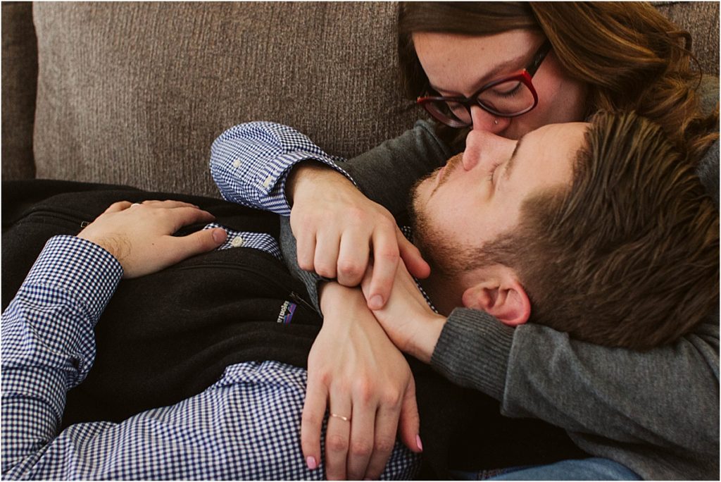 Flint couple Steven & Sarah snuggle up on the couch of their downtown home.