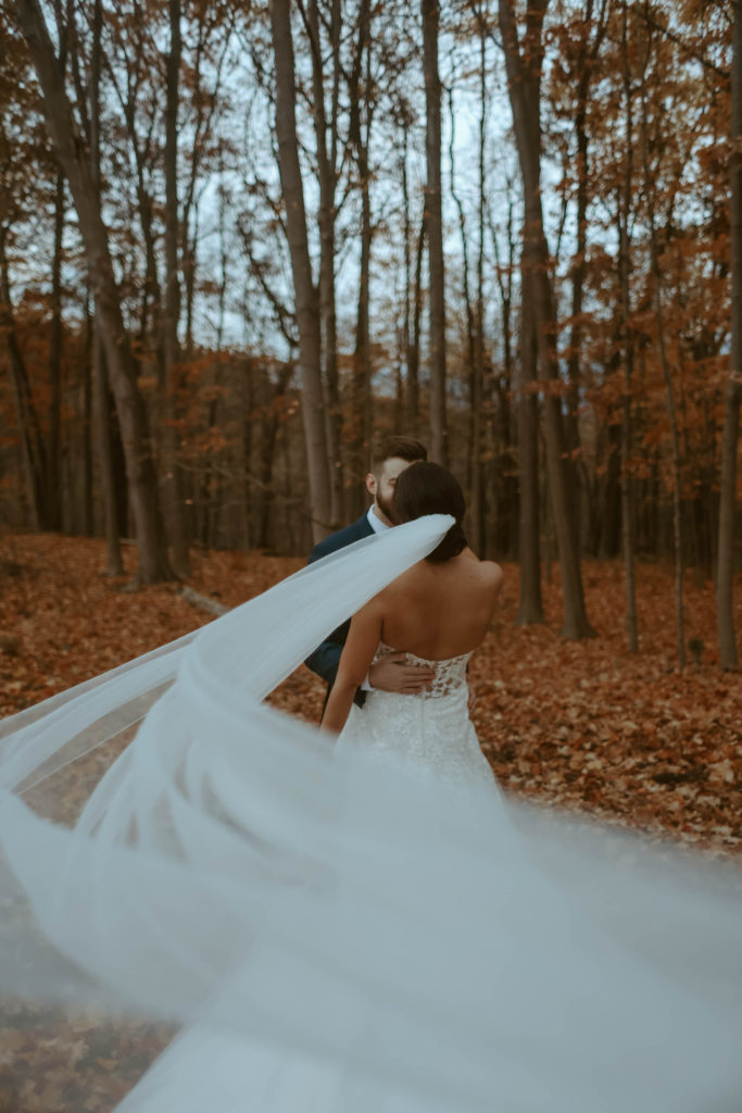Bride and groom in a Michigan forest.