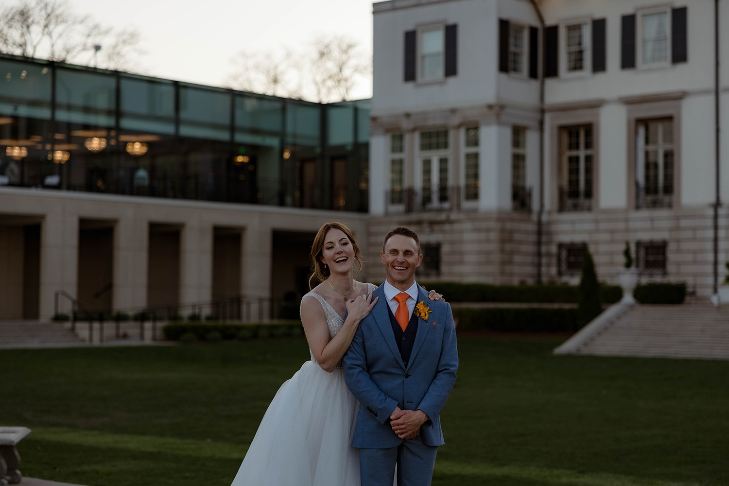 bride and groom at a wedding day at the war memorial in grosse point, michigan.